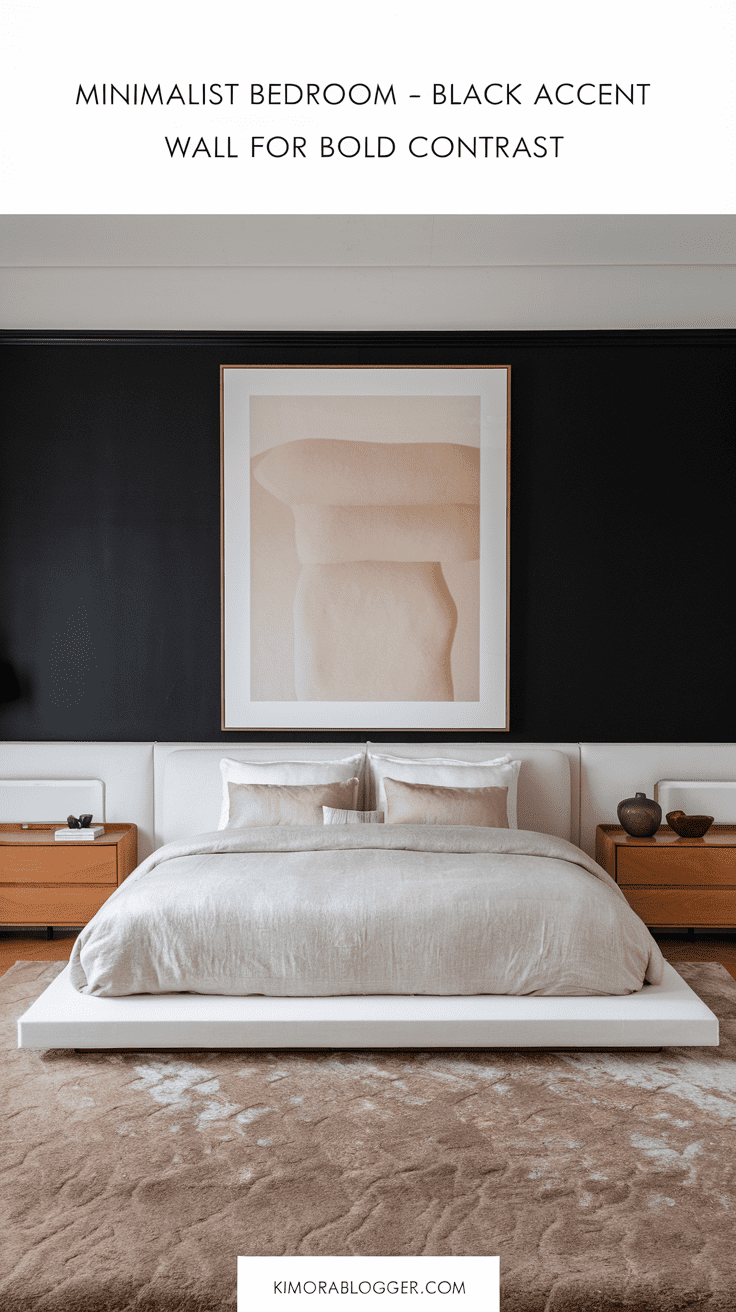 A white minimalist bedroom with one matte black wall behind the bed. The room features a sleek white platform bed, warm wood nightstands, and a large framed abstract print in soft beige. A linen duvet and a plush neutral rug soften the contrast.